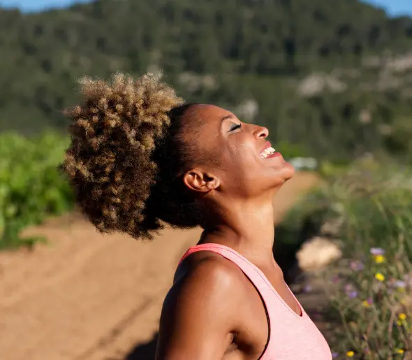 A happy woman with her arms outstretched